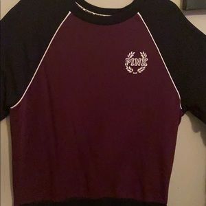 A pink sweater/ long sleeve tee. Maroon & black.